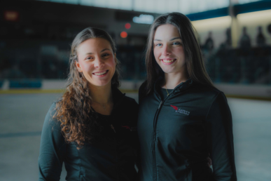 Bentley students Autumn Coulthard, left, and Elly Monaco, right, pose in the Bentley Arena.