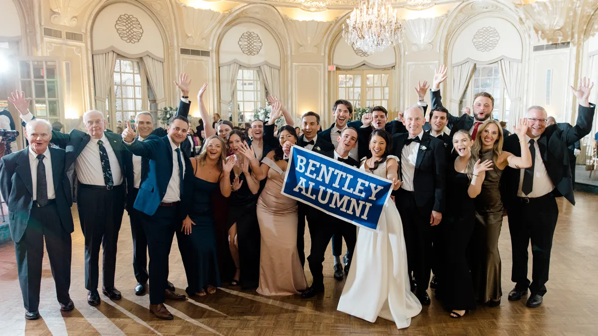 Amanda M. Condrin ’19 and Brian J. Daury ’19 pose with family and friends