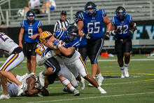Falcon tackles opponent