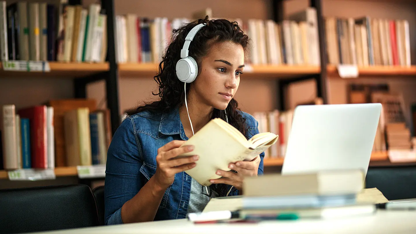 Female studying with earphones