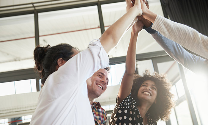 young people high-fiving