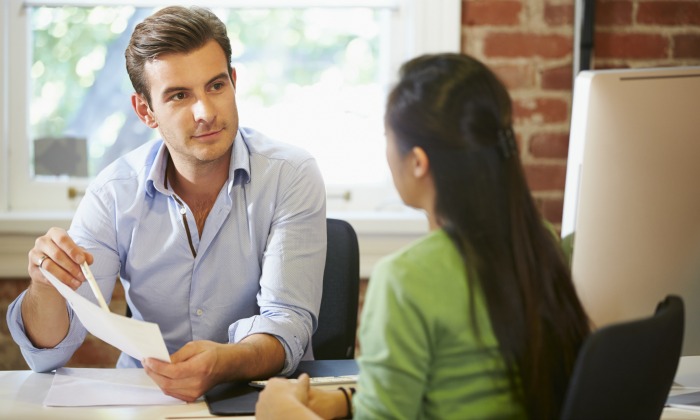 Man interviewing a woman