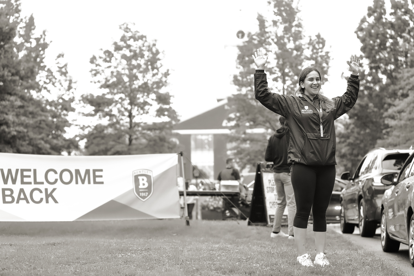 female student welcoming arrivals during Move in Day 2021