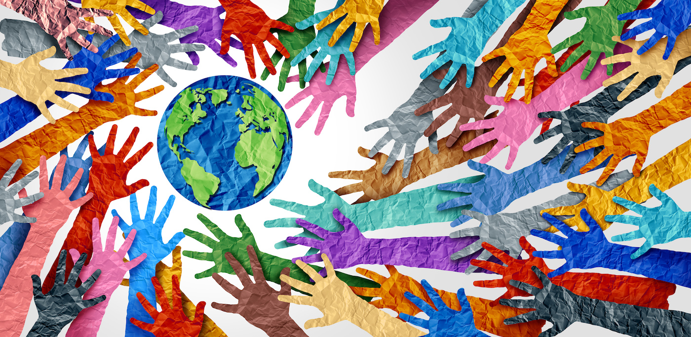 Illustration of multiple colored hands reaching for the globe