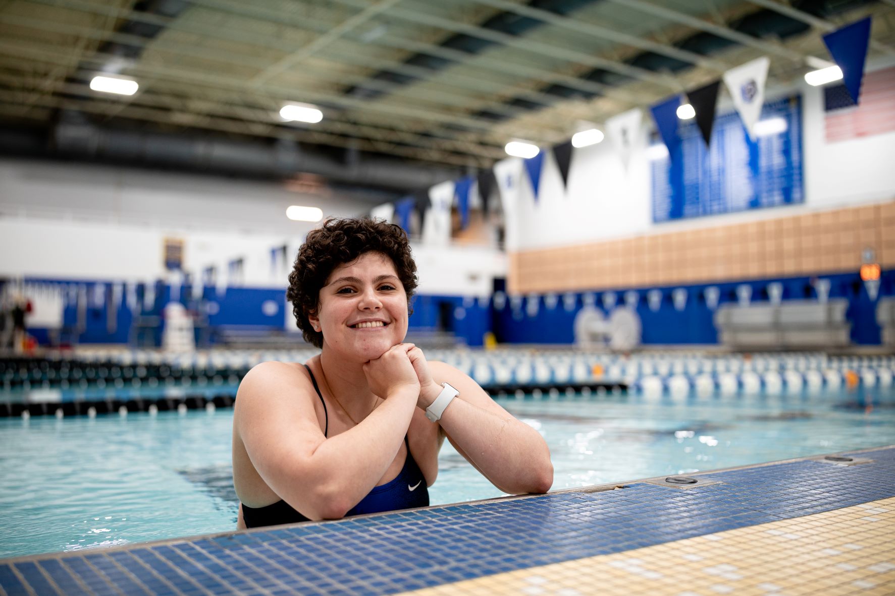 Rona Mejiritski ’22 in pool looking out with hands together