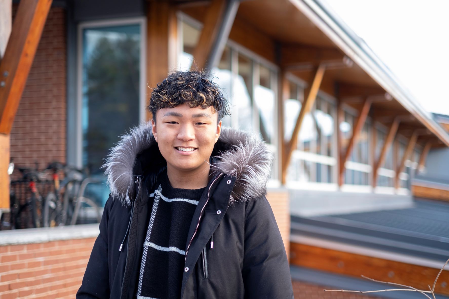 Alex Kim standing outside in winter coat