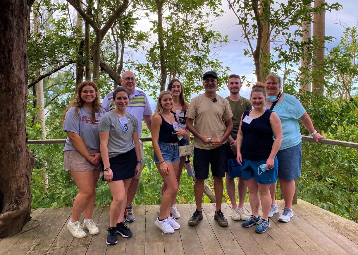 Bentley graduates students and faculty advisors pose with Mahmood Patel, owner of the Coco Hill Forest in Barbados.