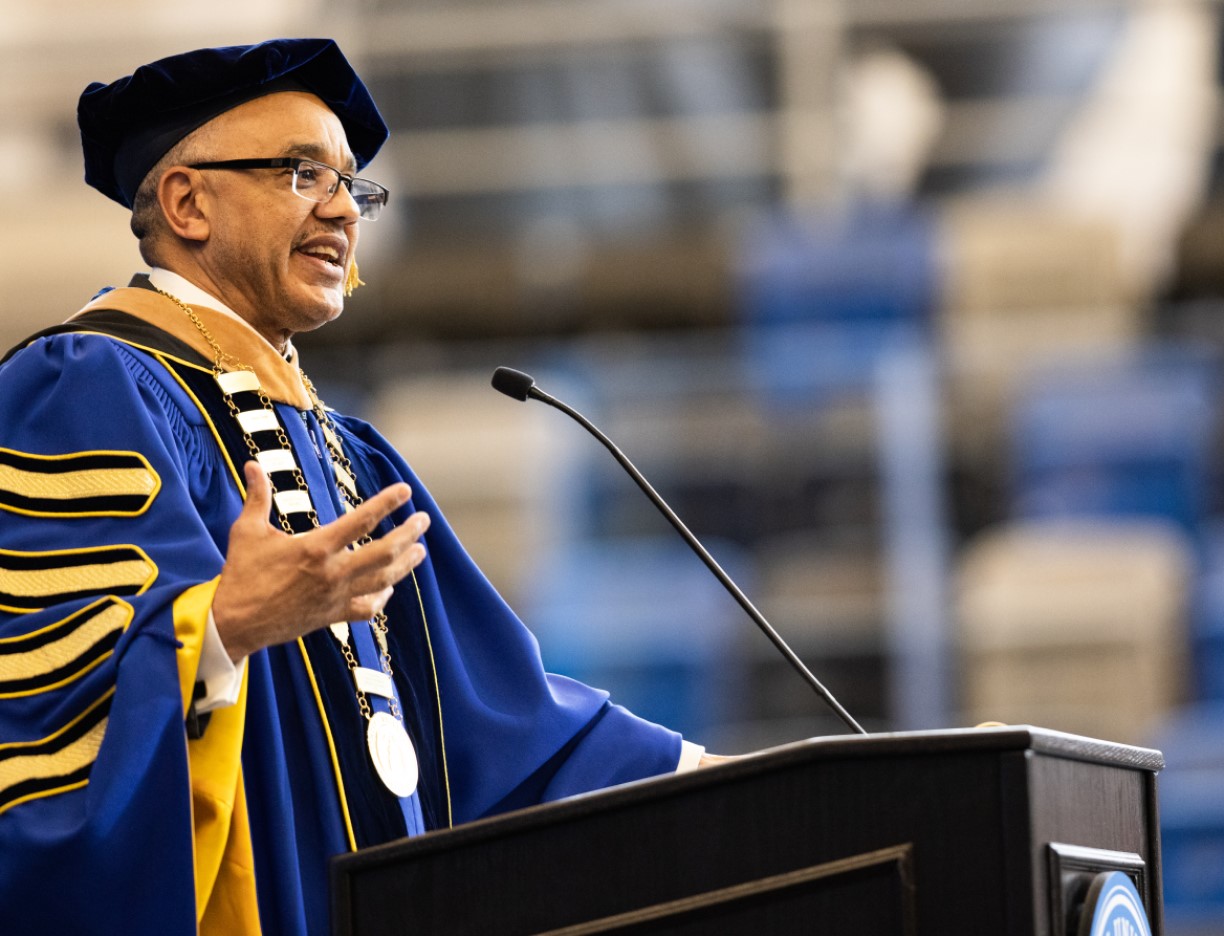 President E. LaBrent Chrite stands at the podium to deliver his inauguration remarks