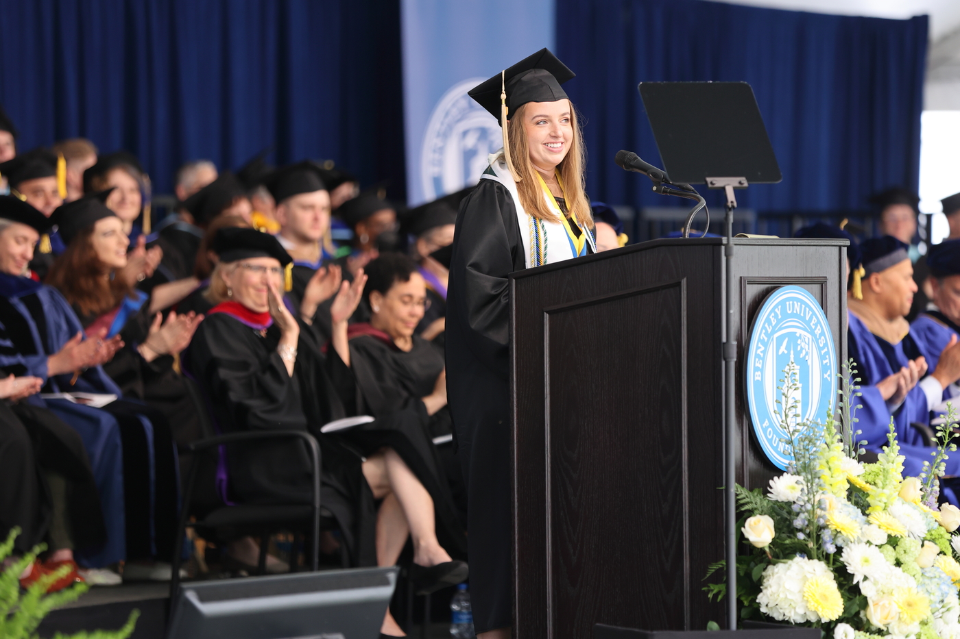 Erin Buckmeier '22, Senior Cabinet President, delivers her remarks as audience members clap