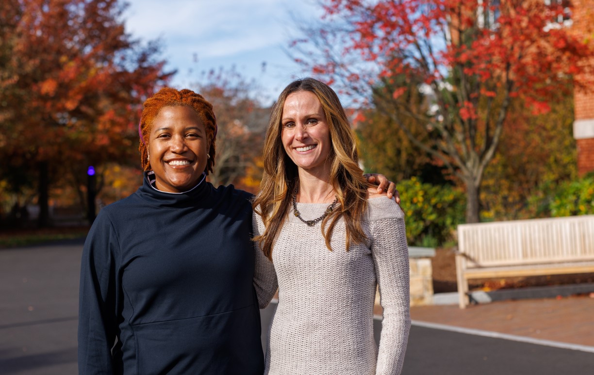 Author and activist Alison Mariella Désir poses with Lecturer in Marketing Erin Flynn outside of the Bentley Library.