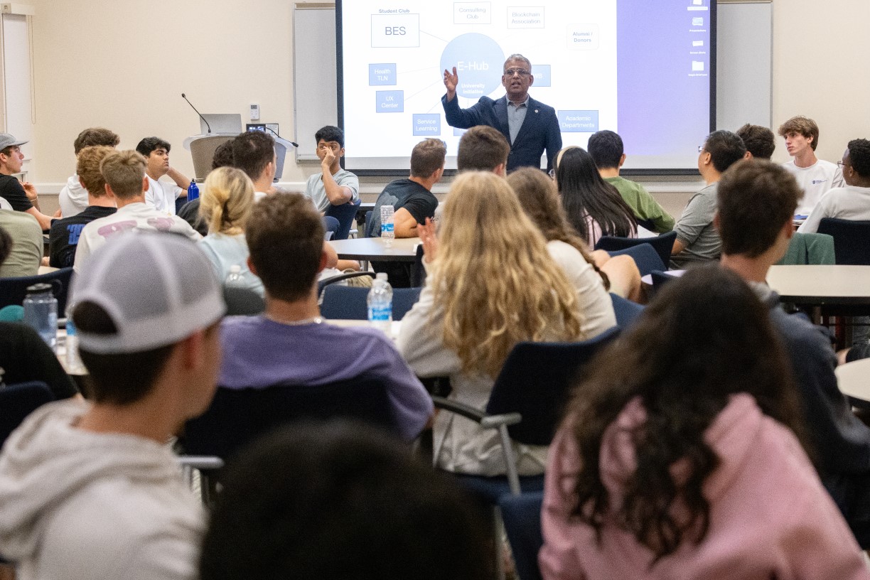 Trustee Professor Sandeep Purao speaks with students about the university's new E-Hub initiative during a meeting of the Bentley Entrepreneurship Society.