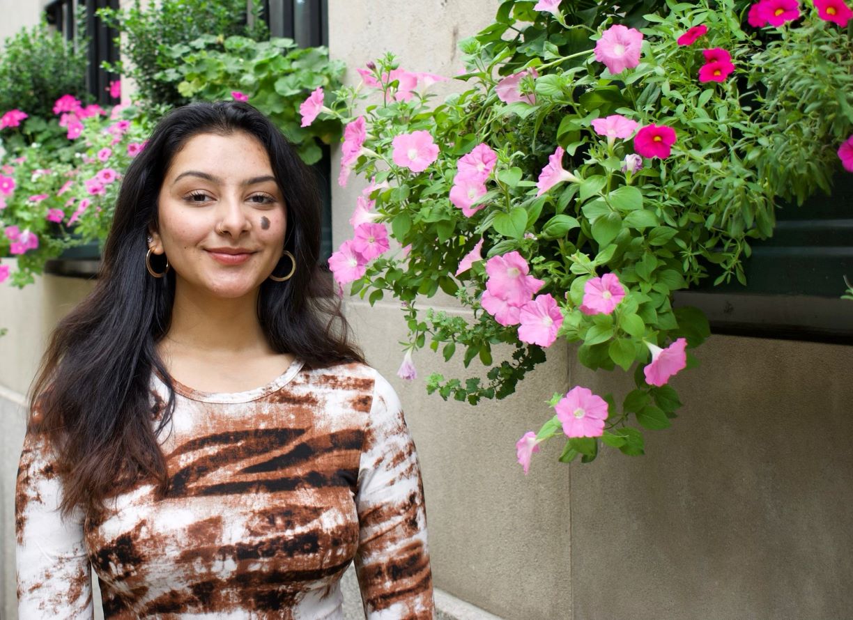 Medha Prakash in front of building with cascading flower boxes