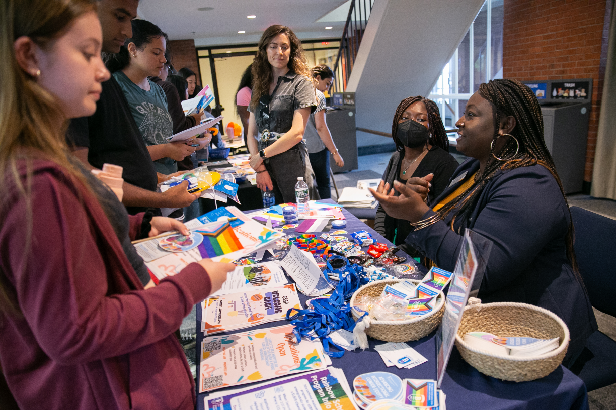 Nana Adu and Dominique Wilburn, co-advisers of the Rainbow Scholars program, chat with Bentley students.