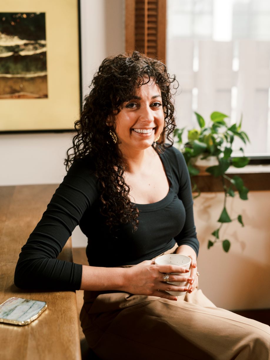 Bentley alumna Kimberly Dowd sitting at desk