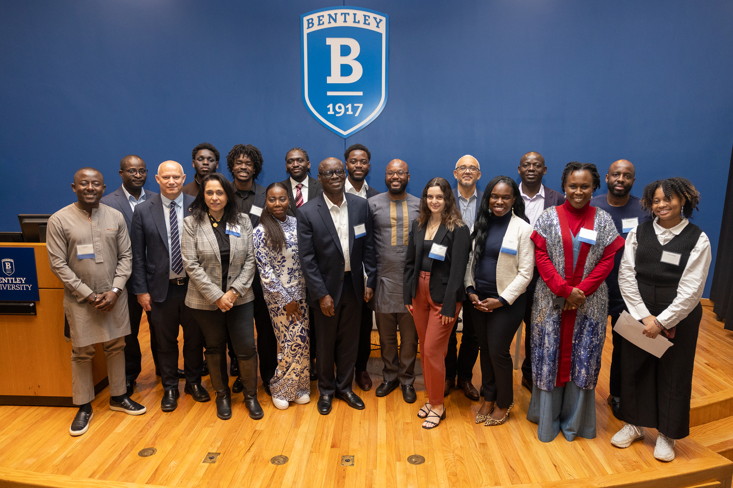 a large group of people on stage at the Bentley University African Student Association Business Conference
