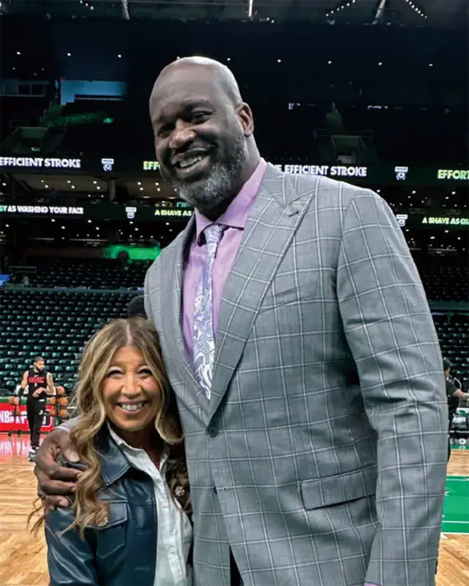 Joanne Borzakian Ouellette ’85, P ’20 ’23 embraces Shaq