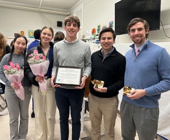 Bentley Service-Learning and Civic Engagement Center students and staff pose with "Rags" LaCava Community Service Award