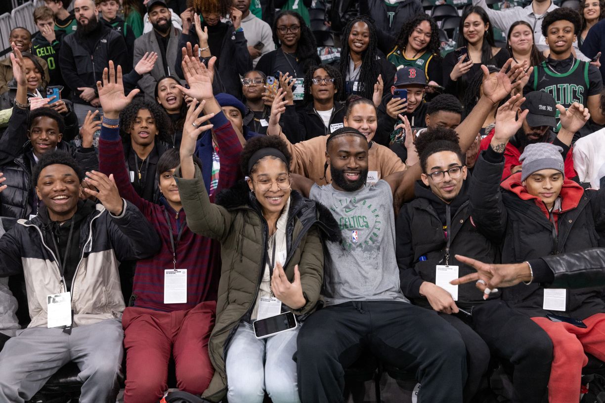 Boston Celtics All-Star wing Jaylen Brown poses with students at Celtics Career Day presented by Bentley University