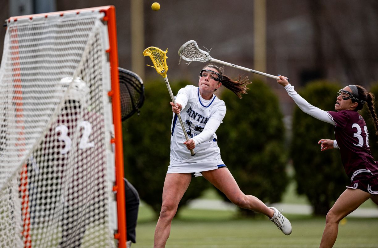 Bentley Women's Lacrosse player Amber Kiricoples takes a shot on goal during a game