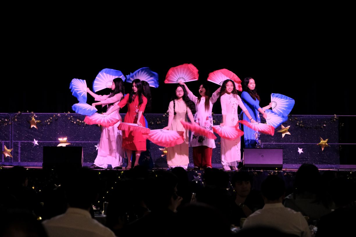 AS2A fan and hat dancing group performs a fan dance on stage at the Asian Culture Gala, sponsored by the Bentley Asian Students' Association