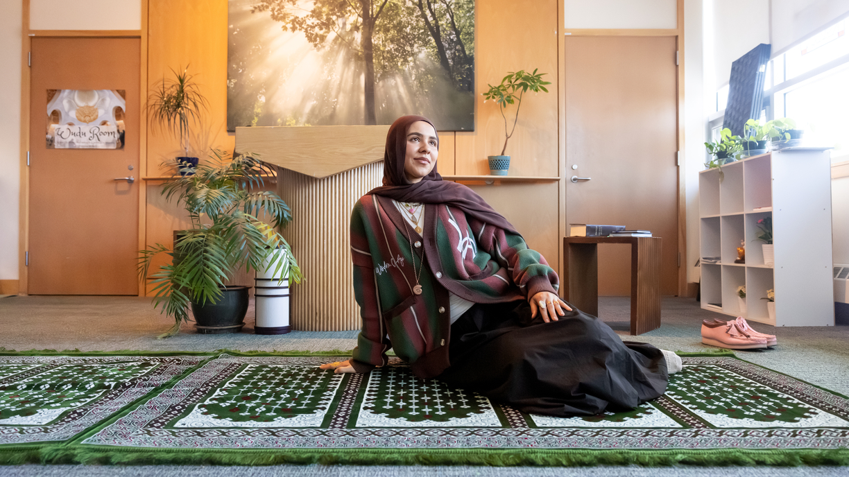 Bentley student Laila Altanbour '25 sitting in the Sacred Space