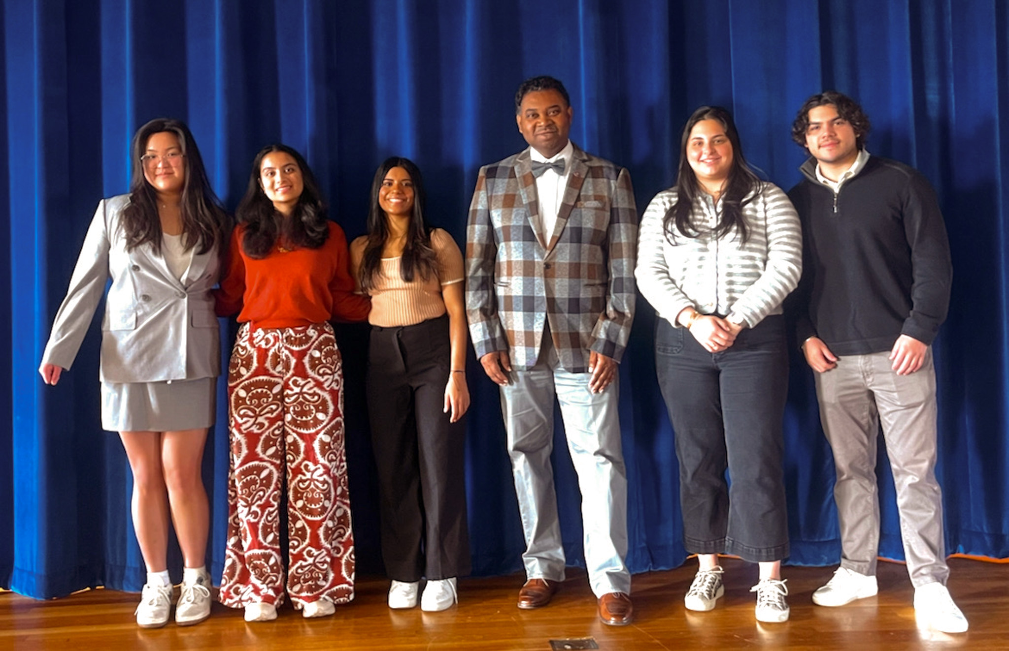 Ash Apsangi ’25 standing with peers