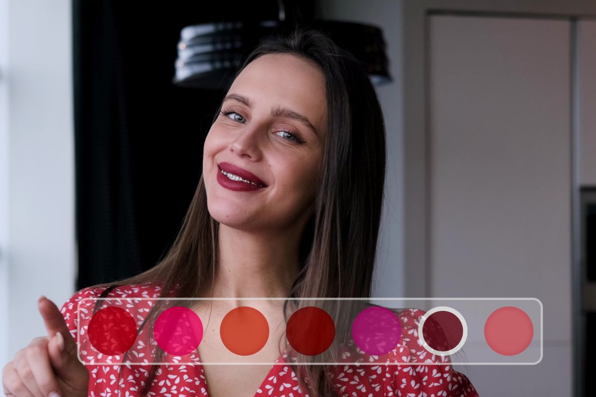 A woman chooses a lipstick color in a virtual store menu with augmented reality, pressing a color picker button on a smart touch web screen