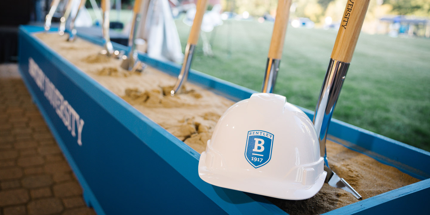 a hard hat and shovels at the groundbreaking