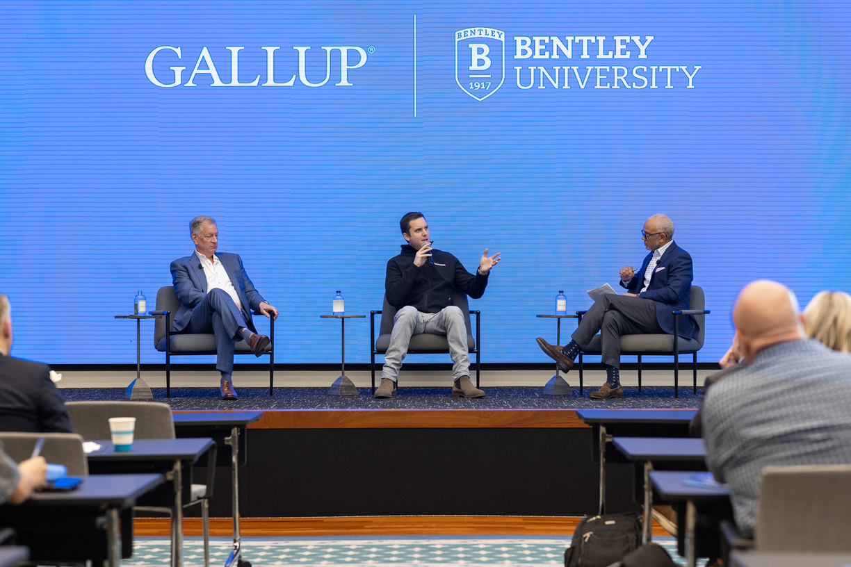 Bentley President E. LaBrent Chrite on stage at a 2025 Bentley-Gallup event in DC with Guardian Bikes Founder and CEO Brian Riley and Dennis Rodenbaugh, president and CEO of Dairy Farmers of America