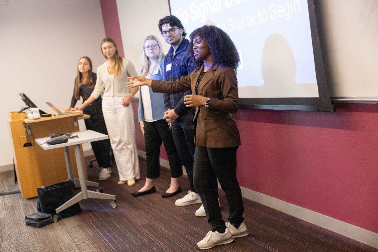 A group of five Bentley students presents at Undergraduate Research Day 2026