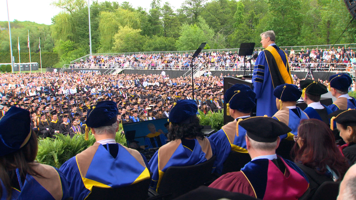 Charlie Baker speaking to the commencement crowd