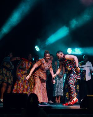 Mukosolu Obukwelu dancing on stage with his mother