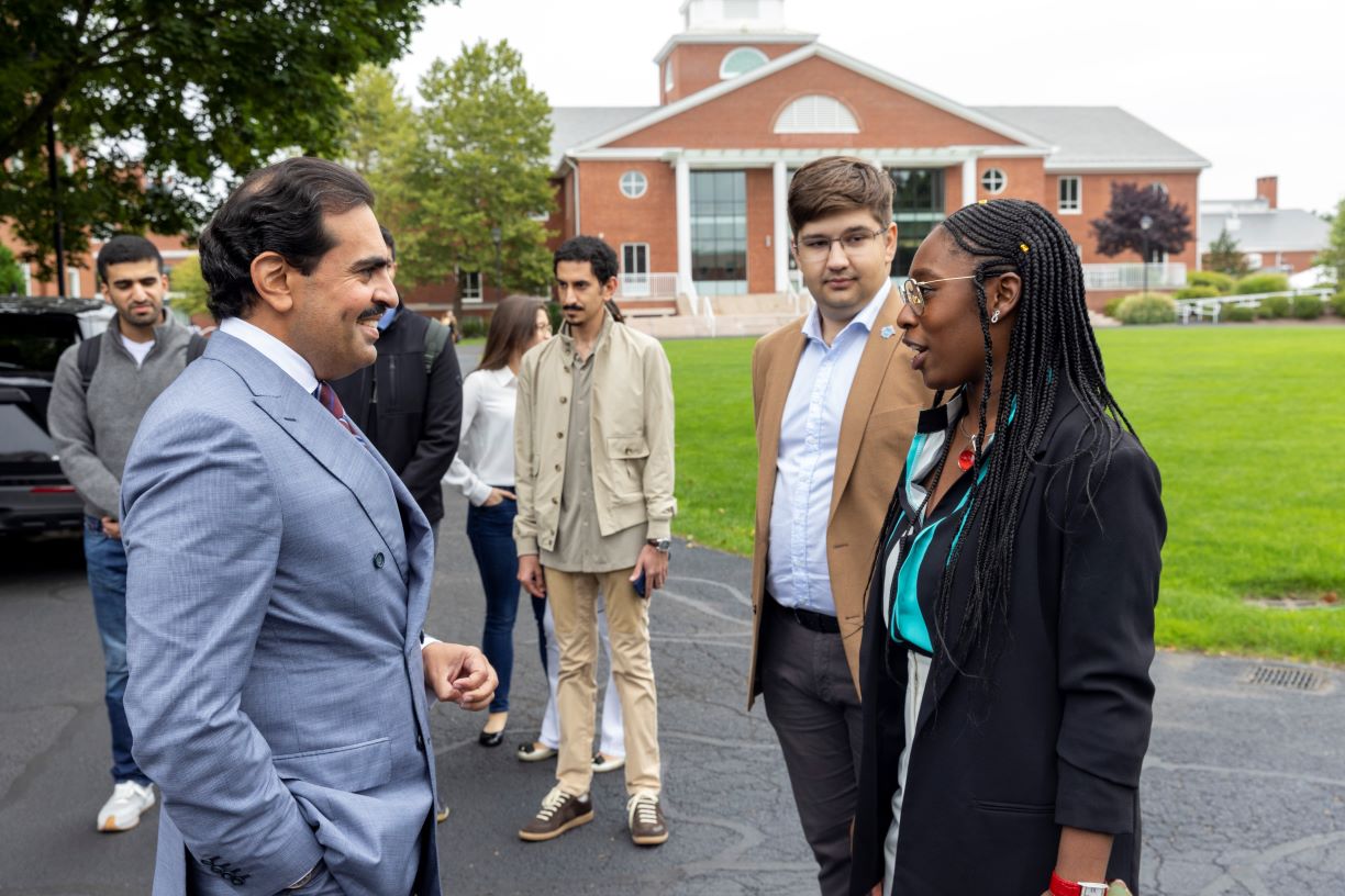 Ambassador of Bahrain speaking to Bentley students outside of library