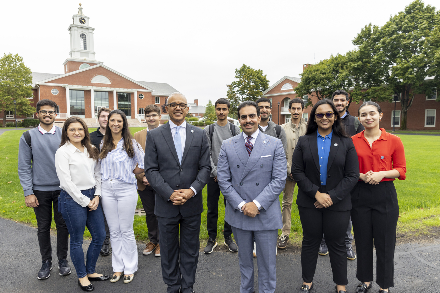 The ambassador, President Chrite and students pose for a photo