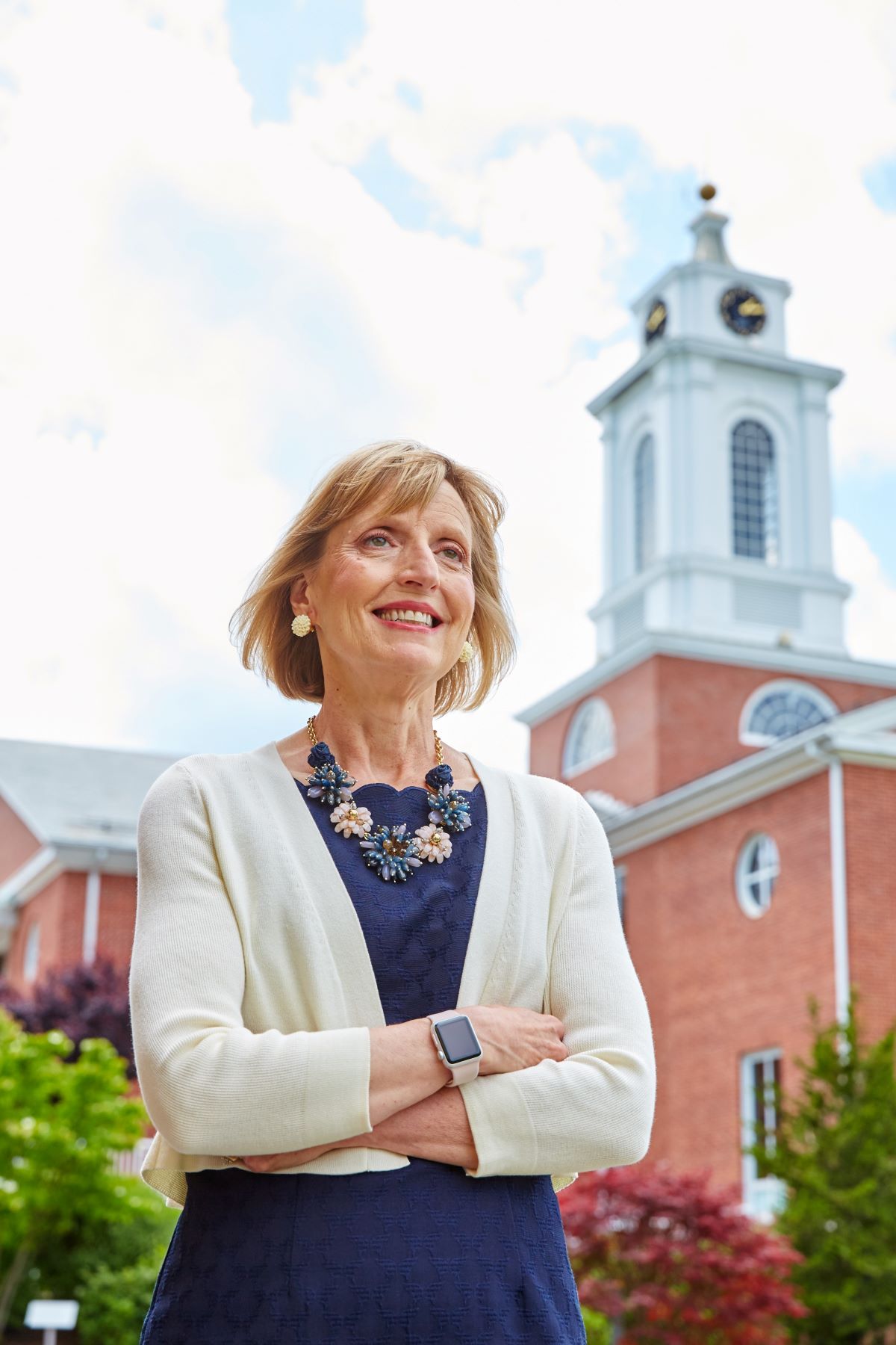 President Davis-Blake by the Bentley University clock tower