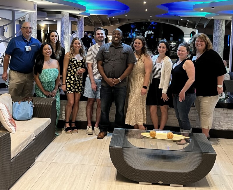 Clinton Gittens MBA ’03 with Bentley graduate students in their Barbados hotel lobby.