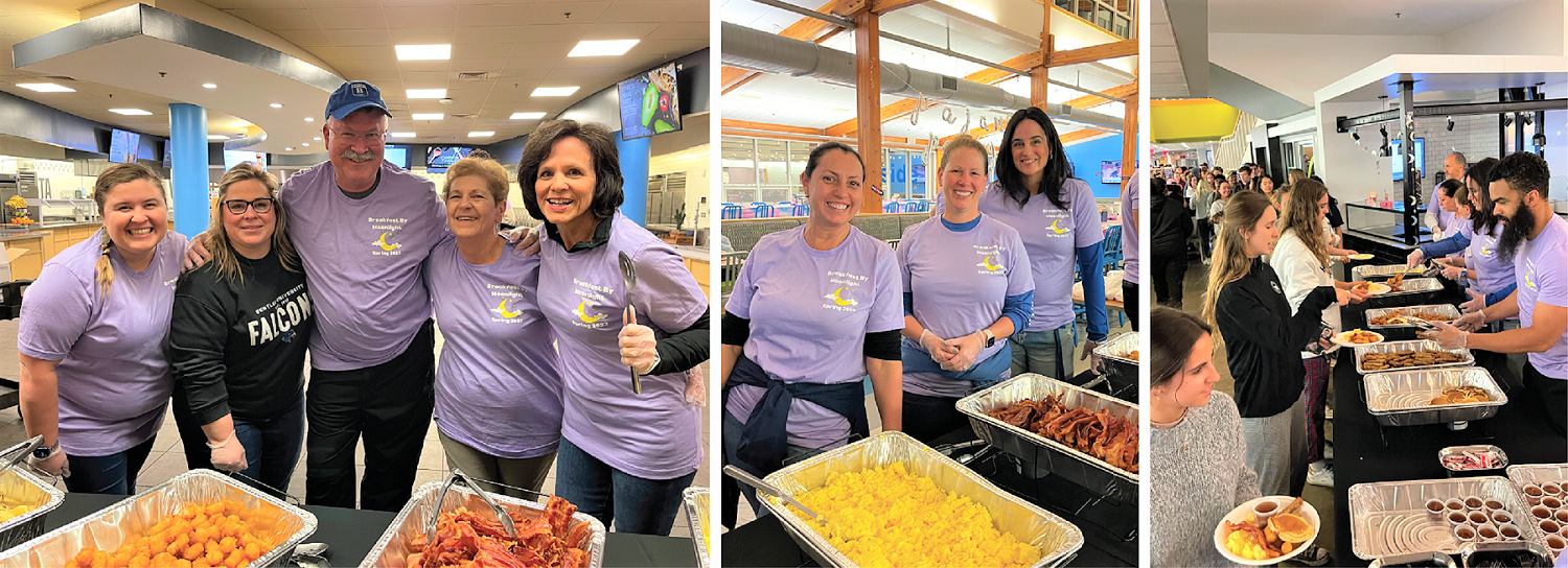 Staff serving students breakfast