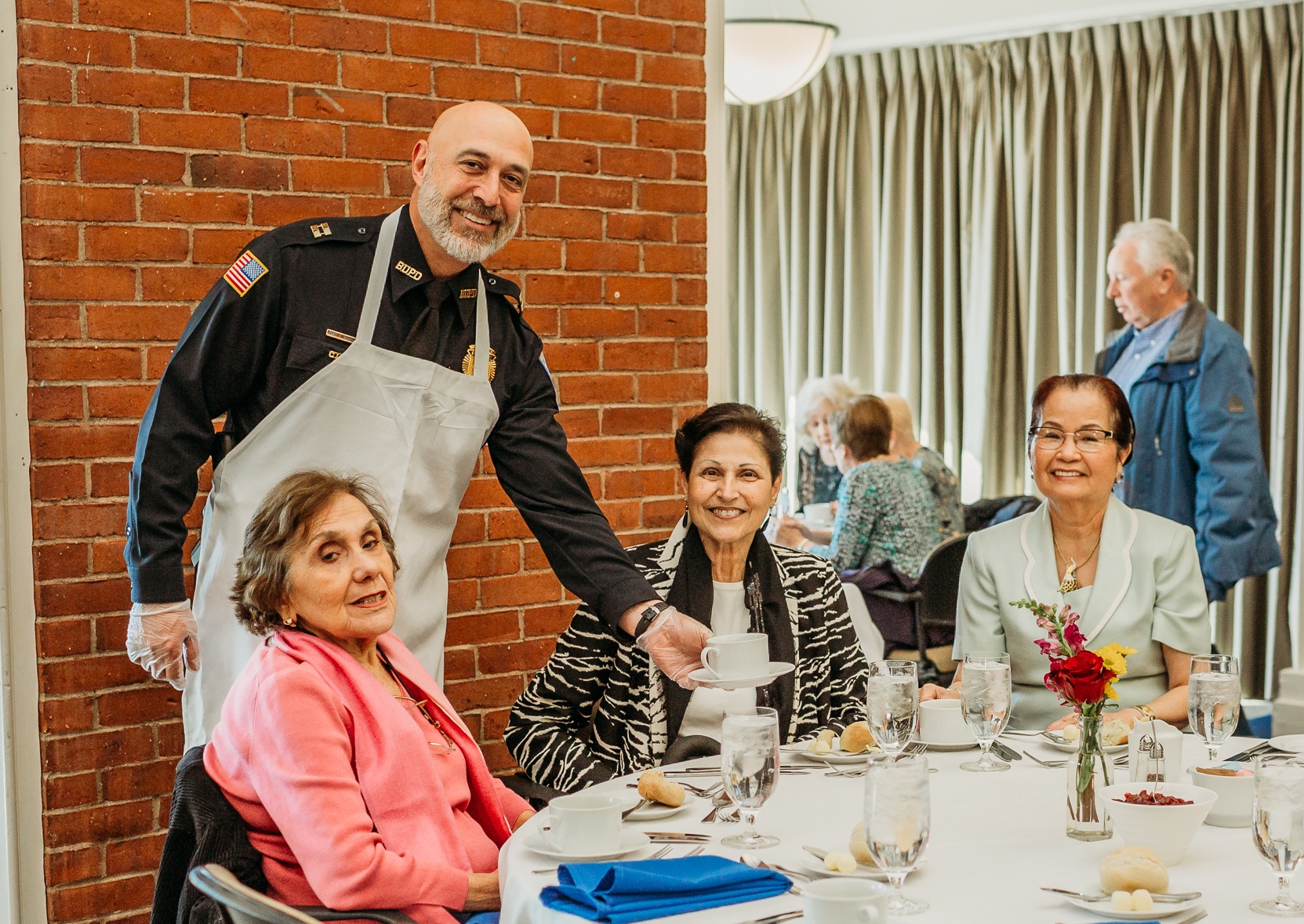 Captain Frank Bourgeois serves guests