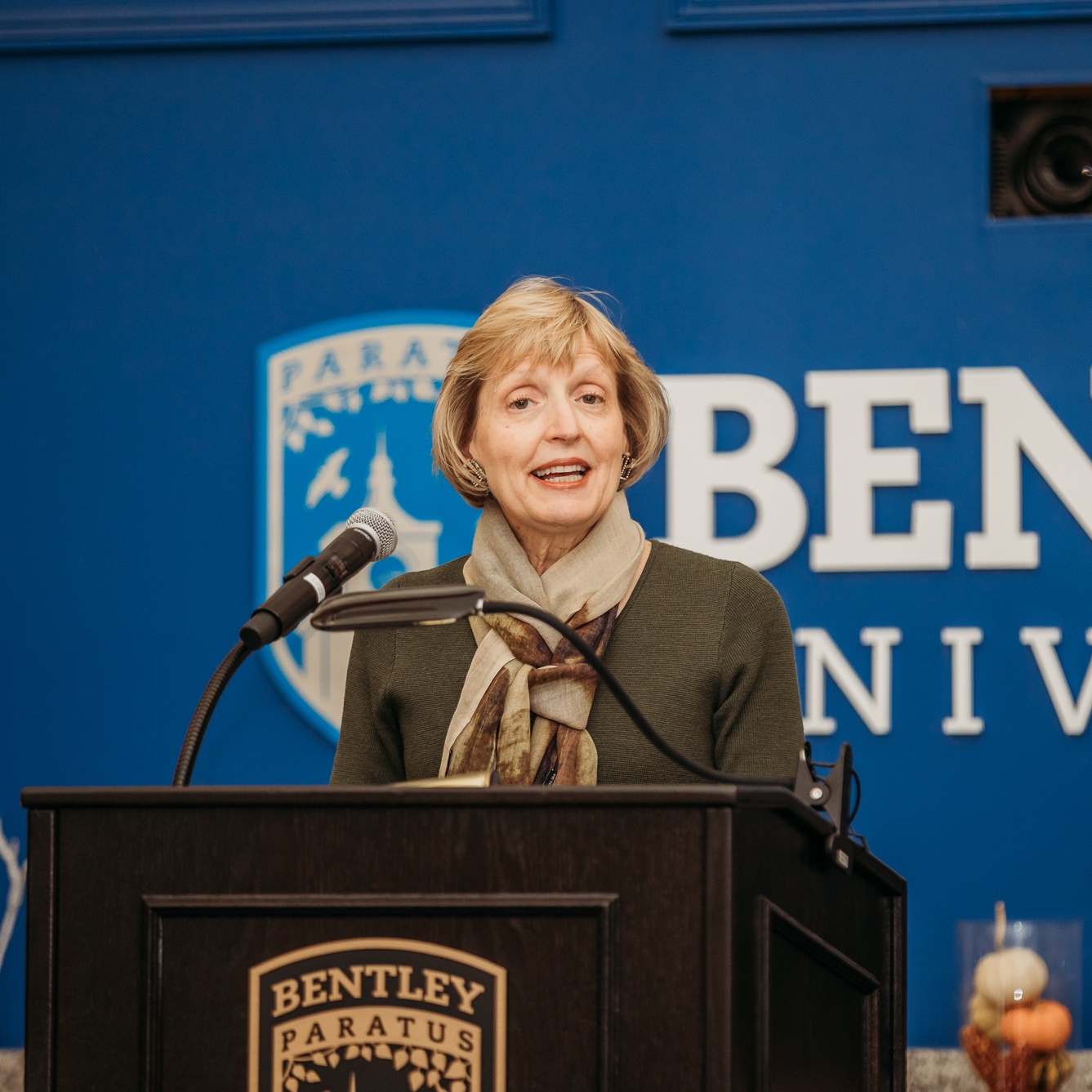 President Davis-Blake welcomes guests to the Thanksgiving luncheon