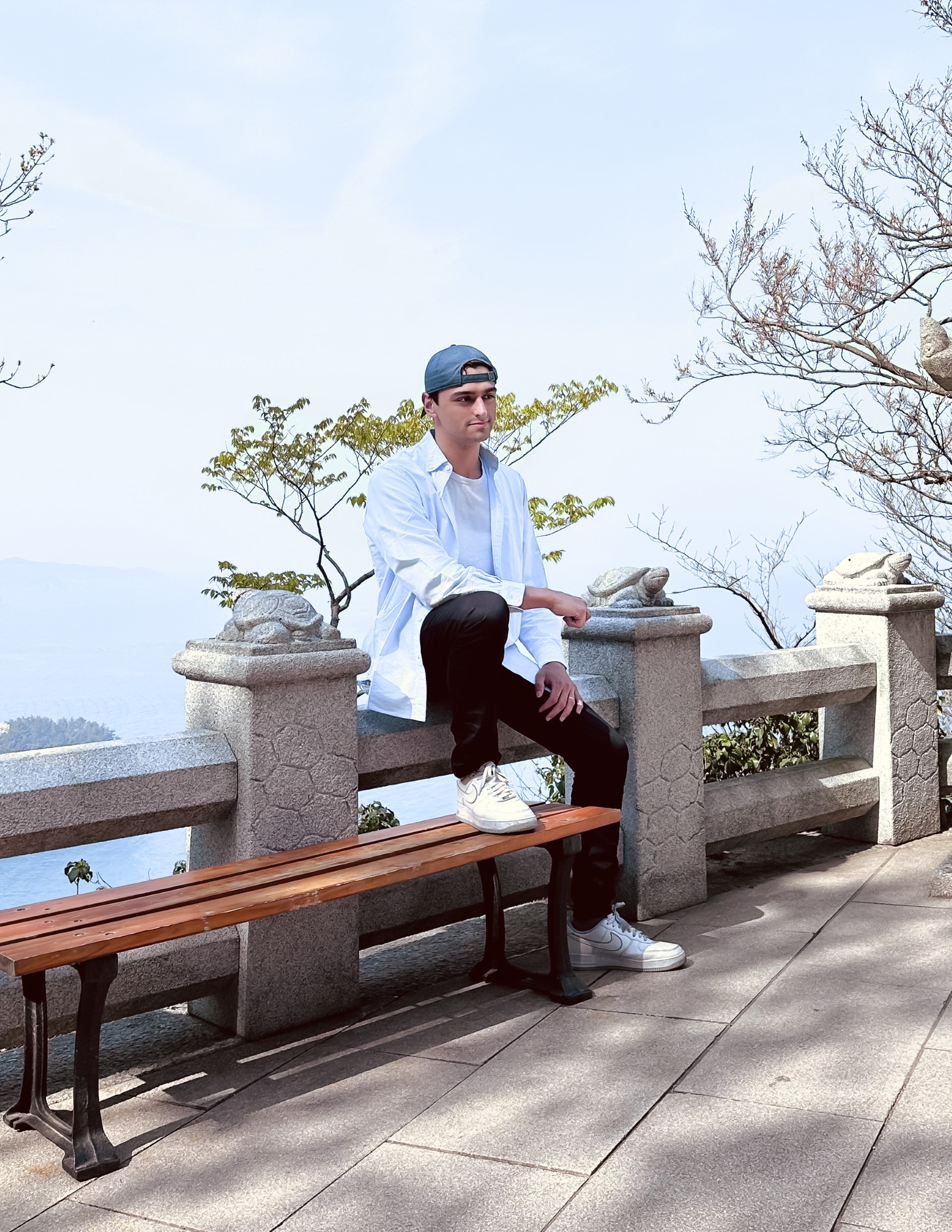 Mike sitting on a fence