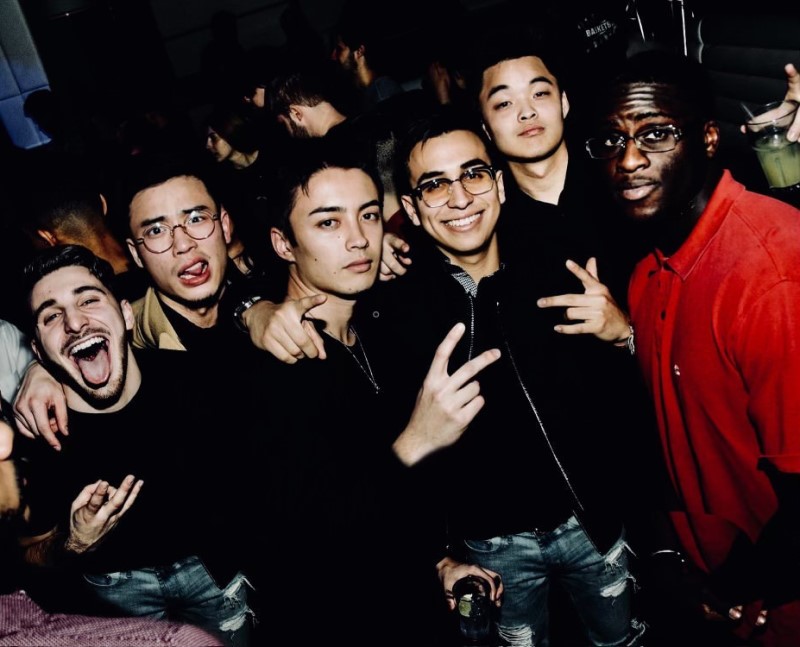 Jonathan Yu poses with a group of friends he met at Bentley.