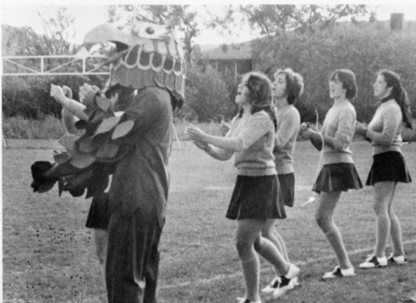 Falcon mascot and cheerleaders at Bentley Homecoming, 1975