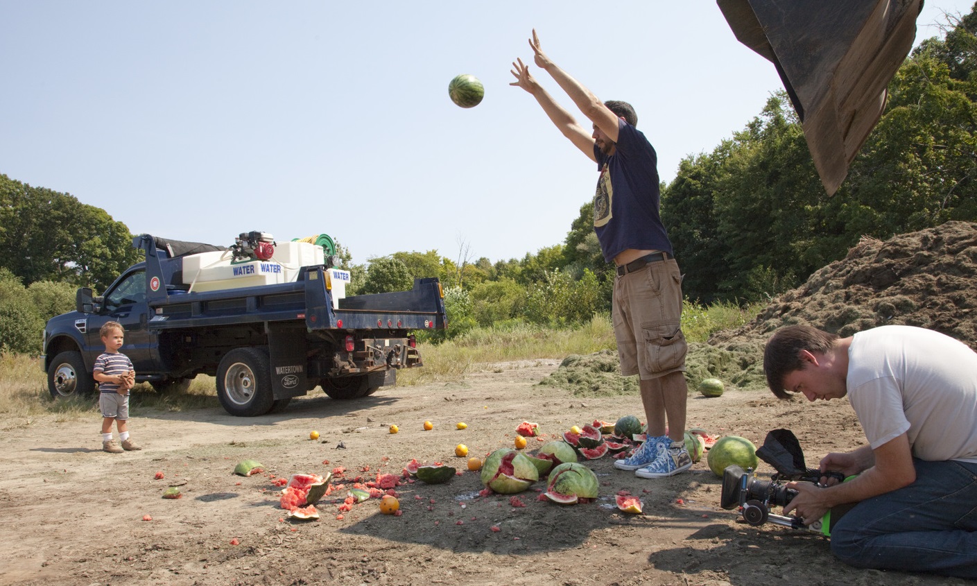 Jeff filming on set throwing watermelons