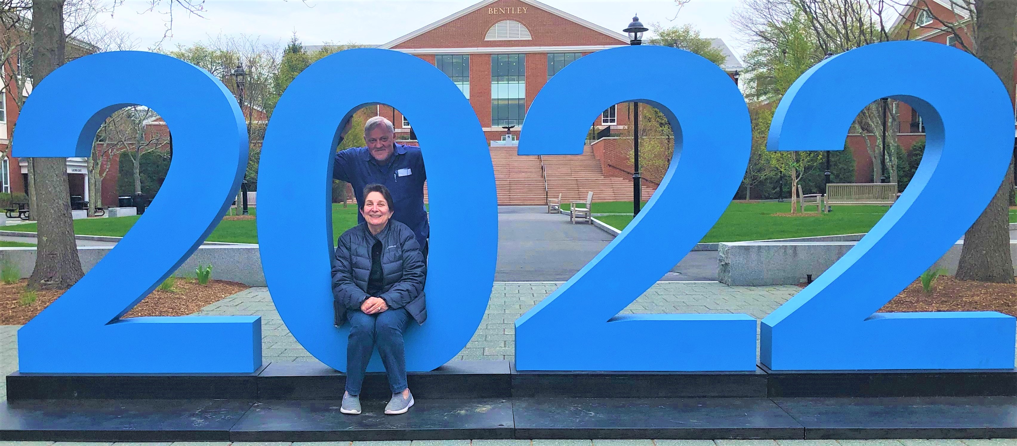 Maria and David in front of the 2022 sign