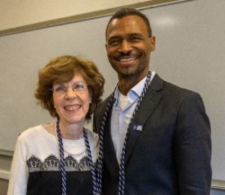 Photo of Bentley professors and Tri-Alpha advisors Jackie Masloff, left, and Joao Resende-Santos