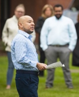 Professor Mateo Cruz speaks to the crowd during Bentley's 5th annual Pride Flag ceremony