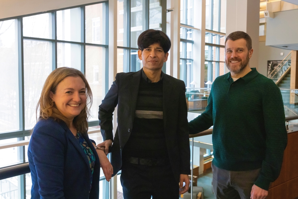 Professor Danielle Hartigan, Dhaval Dave and Rob DeLeo pose in Smith Hall.