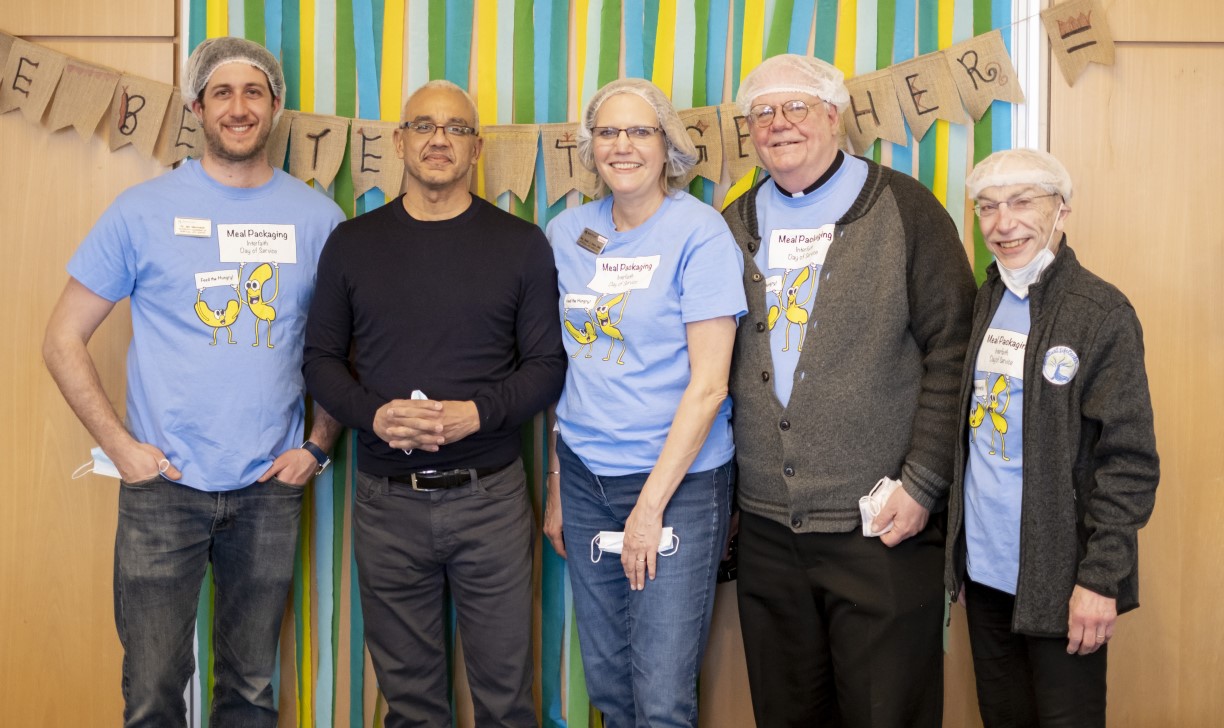 Bentley President E. LaBrent Chrite poses with four Spiritual Life Center staff members during the 4th Annual Interfaith Day of Service