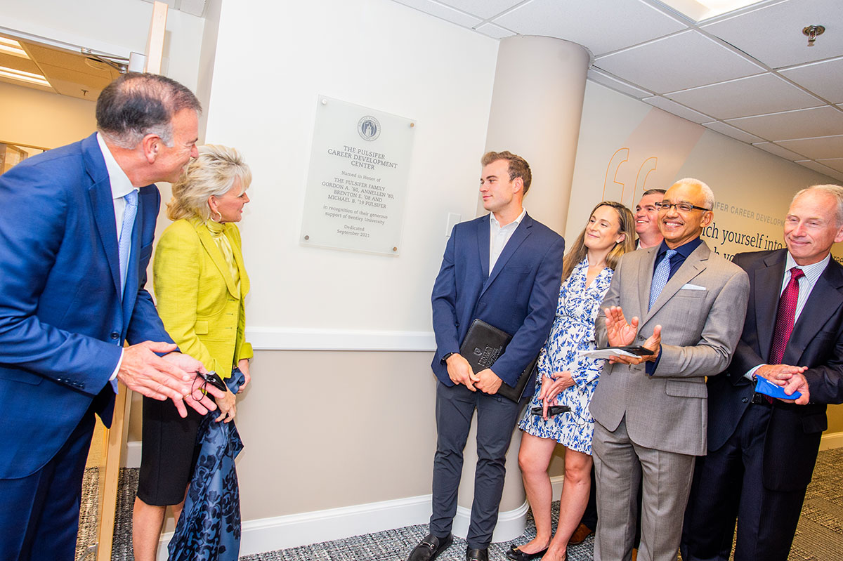 The Pulsifers unveil the plaque for their named center, with President Chrite and Paul Condrin '83