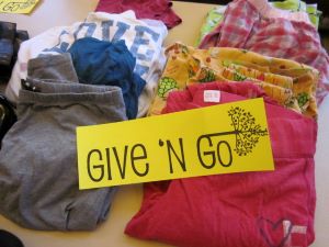 folded clothing on a table for swop shop